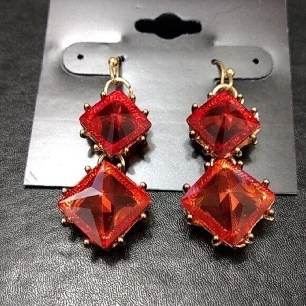 Society gold tone red dangling earrings